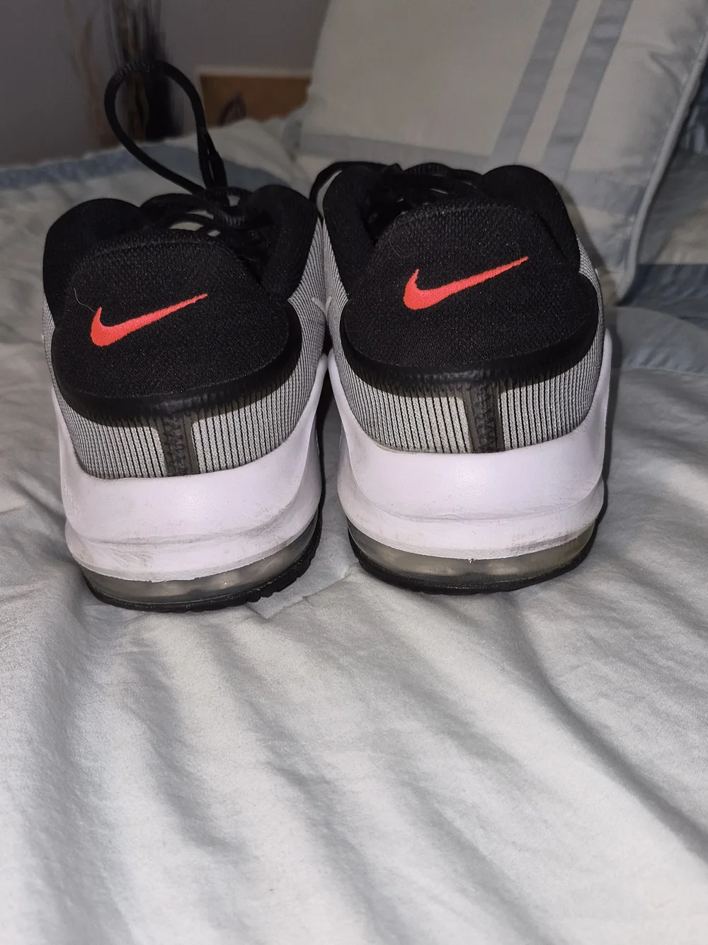 Nike Air Max Impact 4 'Black Bright Crimson' featuring a striped grey and bl